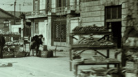 Photograph of food stands set up outside in an Italian city.