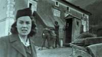 Photograph of a nurse and three men outside in Italy.