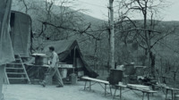 Man standing outside of a tent in Italy.