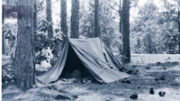 Man sleeps in his tent at the  Carolina Maneuver Area.