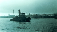 Photograph of a tugboat in New York Harbor.