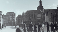 Photograph of people walking around the streets of Rouen, France.
