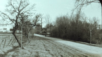 Photograph of man on a road.