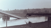 Photograph of a ruined beam bridge in France.