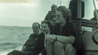 Photograph of people on a boat trip, Great Britain.