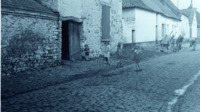Photograph of a group of children playing in a street near Antwerp, Belgium.