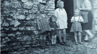 Photograph of group of children in a street near Antwerp, Belgium.