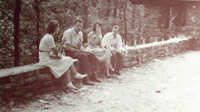 Four spectators smoke at a gubernatorial campaign event for Jim Folsom at Monte Sano State Park.