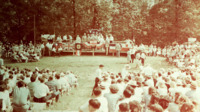 View of the stage and the crowd at a gubernatorial campaign event for Jim Folsom at Monte Sano State Park.