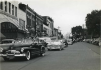 Photograph of a parade in downtown Huntsville, Alabama.