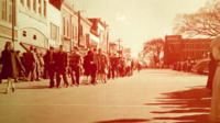 Children march in a parade on Courthouse Square, downtown Huntsville.